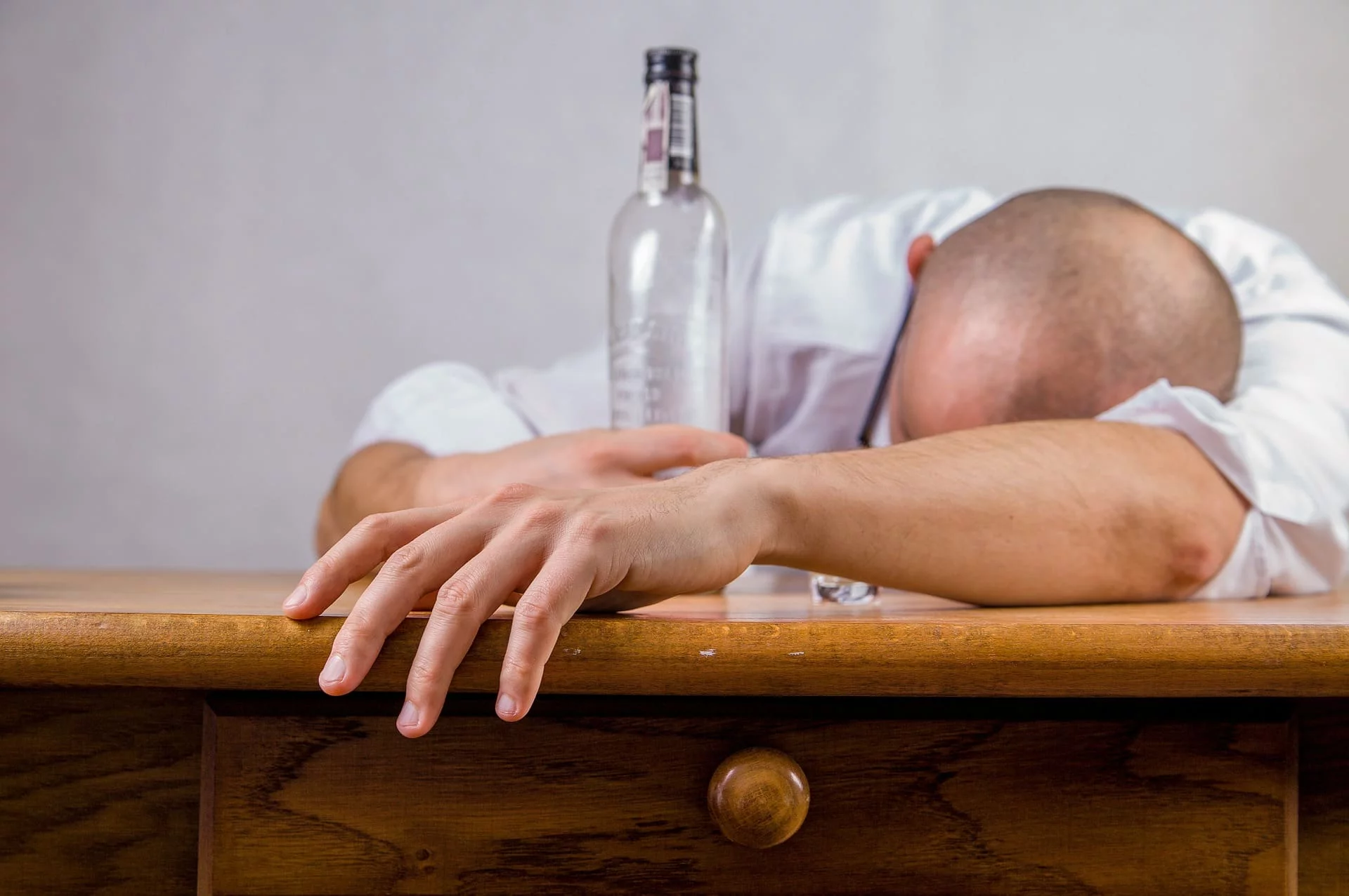 man with bottle of alcohol